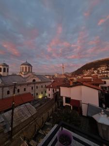 a view from the roof of a city at sunset at Guesthouse Hotel My Home in Prizren