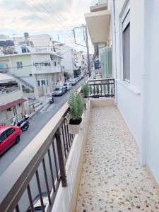 an apartment balcony with a view of a street at D&G City Centre Home in Heraklio