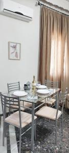 a dining room with a table and chairs at D&G City Centre Home in Heraklio