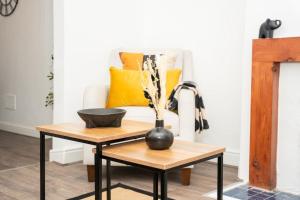 a living room with a table with a vase on it at Stylish home in York - Free Wifi & Parking - Close to Racecourse & City Centre in York