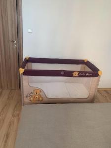 a small suitcase with a teddy bear on it at Chateau Aheloy 2, apartment with sea view in Aheloy
