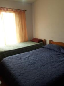 Postel nebo postele na pokoji v ubytování Alojamiento en Santa María de Punilla