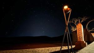 a street light in the desert at night at Erg Chegaga Desert Night in El Gouera