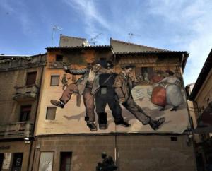 a painting of men on the side of a building at Studio 14 + garaje incluido. Nuevo, elegante, acogedor. in Haro