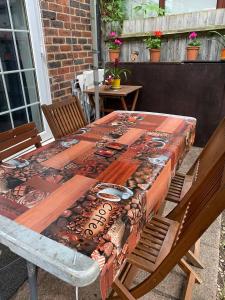 a table with a table cloth on top of it at Morden House in Morden