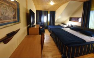 Ένα ή περισσότερα κρεβάτια σε δωμάτιο στο Vila Dubysa +15 φωτογραφίες