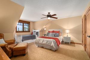 a bedroom with a bed and a ceiling fan at Oak Haven On Leech Lake in Cass Lake