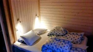 En eller flere senge i et værelse på Sveheim - cabin with an amazing view