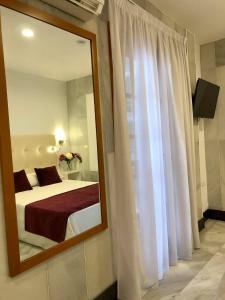Postel nebo postele na pokoji v ubytování Hotel Océano Centro
