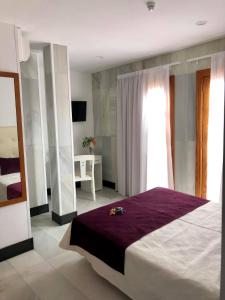 Postel nebo postele na pokoji v ubytování Hotel Océano Centro