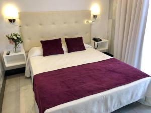 Postel nebo postele na pokoji v ubytování Hotel Océano Centro