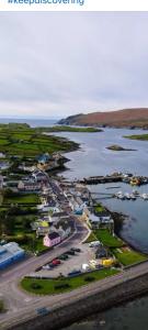 an aerial view of a harbor with boats in the water at Atlantic Sunset in Portmagee