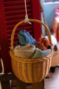 a basket filled with towels and croissants at Famme sta cuiete appartamento Napoli centro in Naples +20 photos
