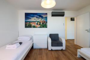 Кровать или кровати в номере Apartmány Mikulovské zahrady