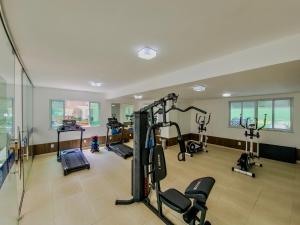 a gym with treadmills and exercise equipment in a building at Aloha Vibes Ap Cumbuco -Beach Place in Cumbuco