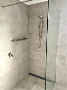 a shower stall with a glass shower door at Seas The Day in Emu Bay