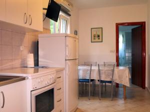 Kuchyň nebo kuchyňský kout v ubytování Apartments Kovacic
