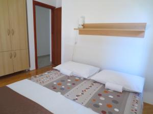Postel nebo postele na pokoji v ubytování Apartments Kovacic
