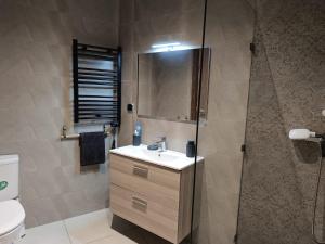 a bathroom with a sink and a shower at AEROPORT TECHNOPOLIS a1 in Oulad Yakoub