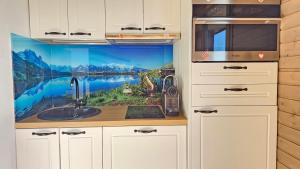 Kuchyň nebo kuchyňský kout v ubytování Appartement pieds des pistes, 6p, piscine ouverte pendant l'ouverture de la station, vue imprenable, Chamrousse