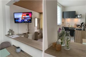 una cucina e un soggiorno con TV a parete di Wohlfuehl Wohnung mit Sternekomfort in Tanne a Tanne