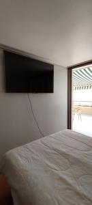 Llit o llits en una habitació de Depto Concón frente a playa amarilla con gran vista al mar