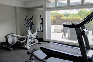 a gym with two exercise bikes and a window at Great family apartment in Tegucigalpa in Tegucigalpa