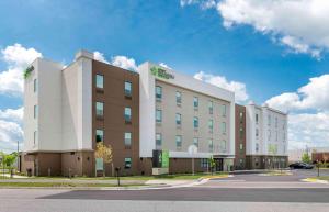 a large building on the corner of a street at Extended Stay America Premier Suites - Fredericksburg in Fredericksburg