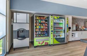 a vending machine with drinks and a tv in a room at Extended Stay America Premier Suites - Fredericksburg in Fredericksburg