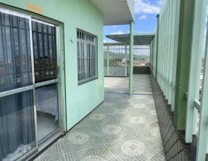 an empty corridor of a building with a balcony at Hotel Shalom in Juazeiro do Norte