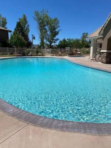 a large blue swimming pool in a house at Spacious & Sunny South Reno Home, Near Trails & Shopping 3 beds in Steamboat