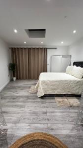 a bedroom with a large bed and a large at London charming bedroom flat in London