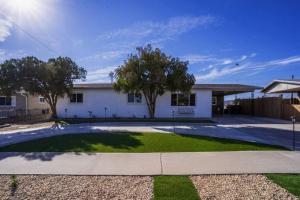 a large white house with a driveway at Discover the Ultimate Trending Hot Tub Retreat in El Paso