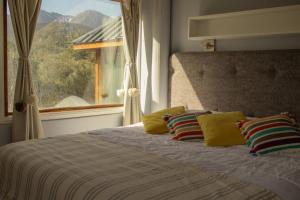 Ένα ή περισσότερα κρεβάτια σε δωμάτιο στο Villa de los Ñires