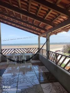 a balcony with a view of the beach at Casa Luz / Beira Mar in Tutóia