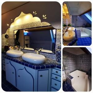 a blue bathroom with two sinks and a mirror at Villa Esperanza les2Pat -Disney -JO nautiques vaires in Lagny