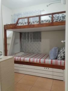 a bedroom with two bunk beds in a room at Kara's Suite in Cebu City
