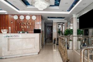 a lobby of a store with a reception counter at Venice Hotel in Ho Chi Minh City