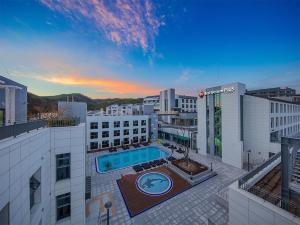 an overhead view of a building with a swimming pool at Best Western Plus GyeongJu in Gyeongju