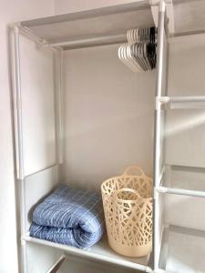 a white closet with some blue towels and a basket at [OPEN SALE] wide room #hotel bedding #Full option in Seoul