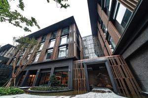 a building with wooden panels on the side of it at CM Service Apartment Suzhou Science Amp Technology Town in Suzhou