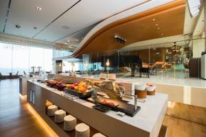 a kitchen with a counter with food on it at Grand Walkerhill Seoul in Seoul