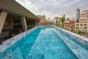 a large swimming pool on top of a building at City Centro by Marriott Ciudad de Mexico in Mexico City