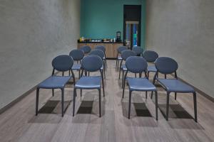 a group of chairs and tables in a room at City Centro by Marriott Ciudad de Mexico in Mexico City +73 photos
