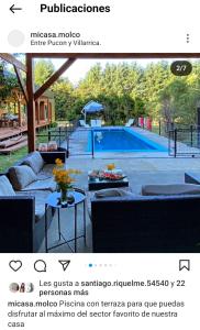página de un sitio web con una foto de una piscina en Fabulosa casa en parcela Molco Alto, en Molco