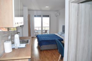 Un pat sau paturi într-o cameră la Studio Sophia