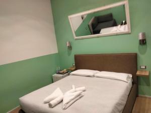 A bed or beds in a room at Mole Adriana Guest House