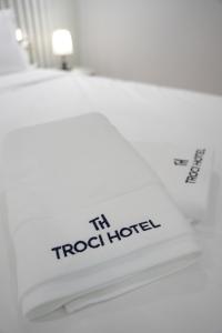 a white book with the words in a hotel at Troci Hotel in Tirana