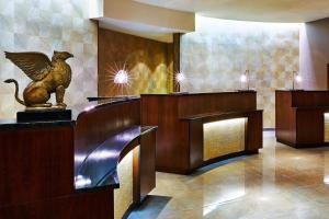 a hotel lobby with a statue of a bird on the counter at JW Marriott New Orleans in New Orleans