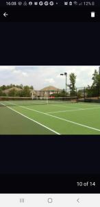 a picture of a tennis court with a tennis at Long Term Retreat Haven in Chapel Hill